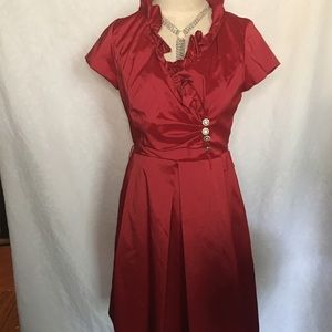 Red Satiny knee length with bling bottom.